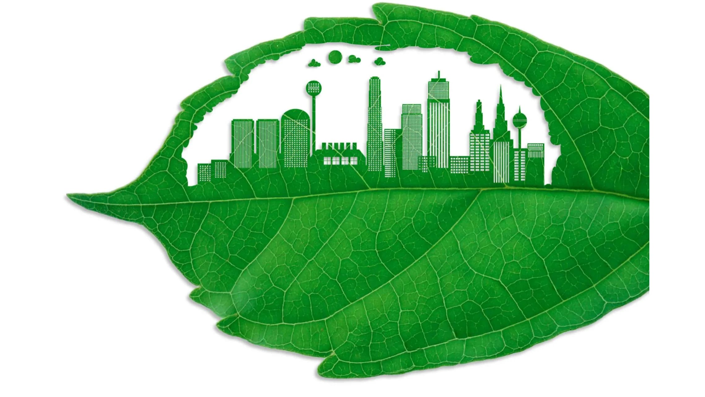Hoja verde con la silueta de una ciudad recortada en su interior